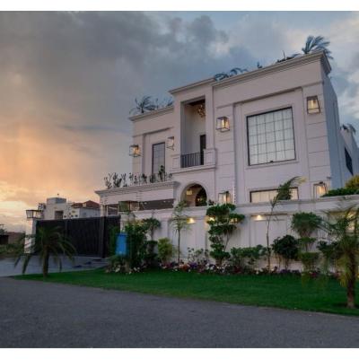 1 kanal House with 2 Floors, Partial Basement and 200 sq.ft extra covered area.